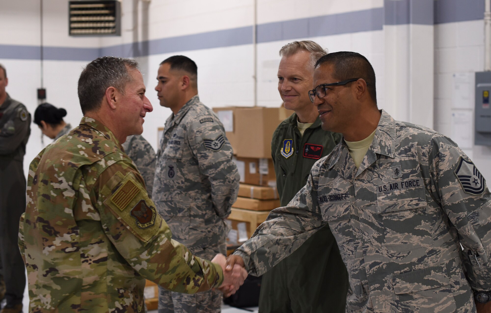 Air Force Chief of Staff Gen. David L. Goldfein congratulates Master Sgt. Manuel Maciel-Rodriguez, noncommissioned officer-in-charge of the 301st Medical Squadron's aerospace medicine operations section, for being named a superior performer Oct. 13, 2018, at Naval Air Station Fort Worth Joint Reserve Base, Texas. Maciel-Rodriguez was recognized for streamlining clinic processes, decreasing wait time and boosting the wing's readiness. Goldfein recognized five superior performers during his visit to the wing. (U.S. Air Force photo by Tech. Sgt. Charles Taylor)