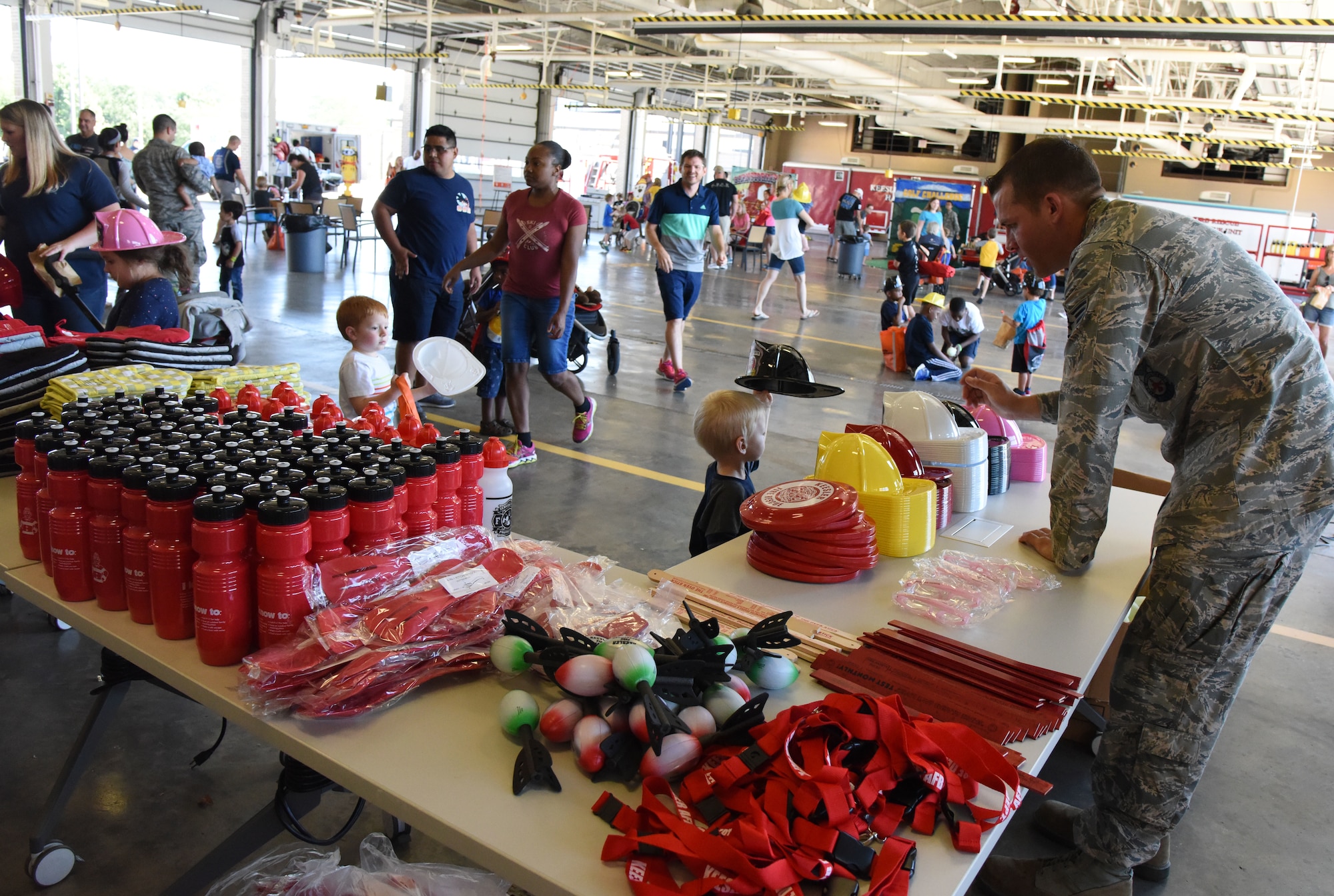 Base families attend the Fire Department open house at the fire station at Keesler Air Force Base, Mississippi, Oct. 13, 2018. Keesler celebrated Fire Prevention Week by conducting random fire drills, visiting various facilities with Sparky the Fire Dog, and conducting an open house at the fire department while providing stove and fire extinguisher demonstrations.  . (U.S. Air Force photo by Kemberly Groue)