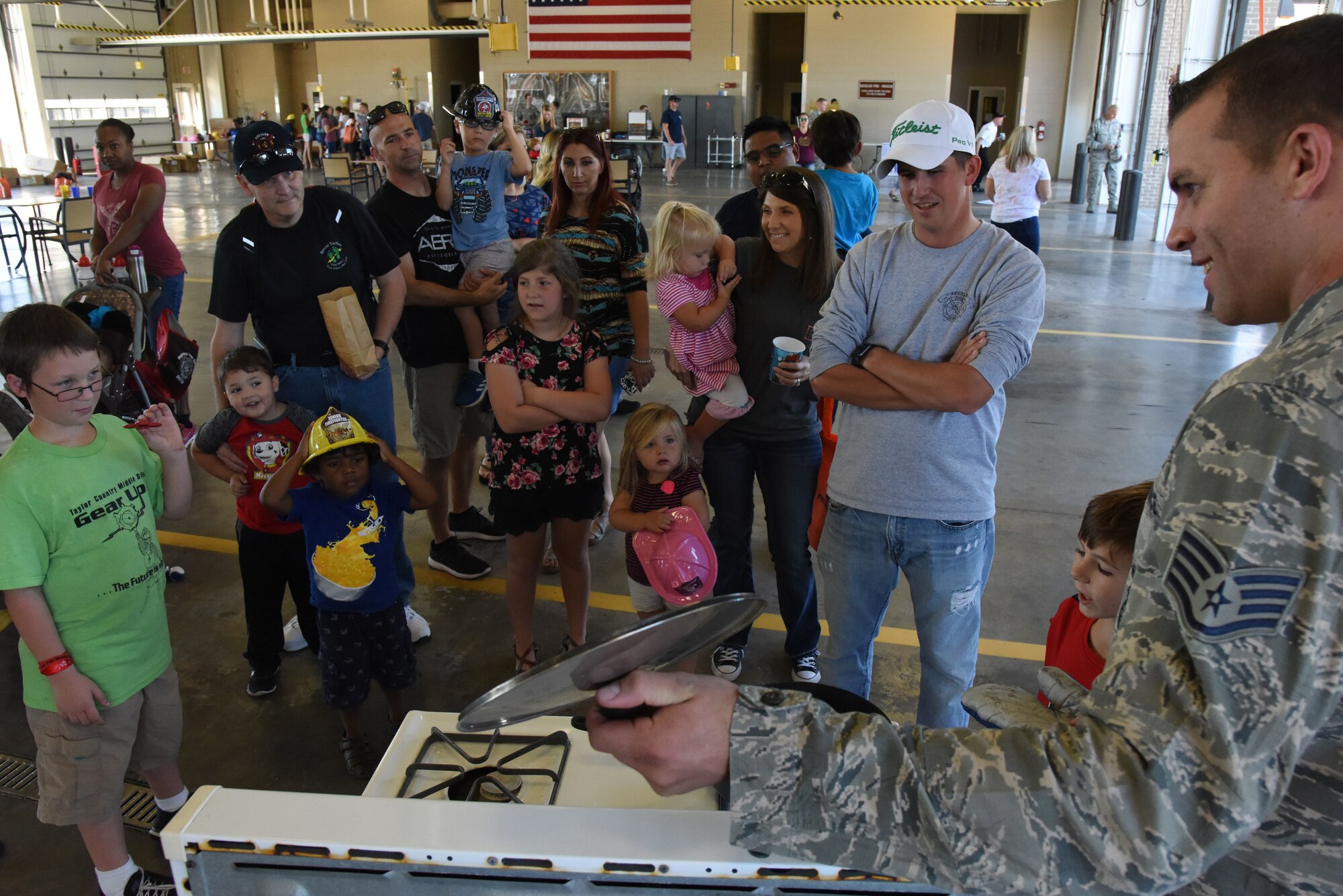 U.S. Air Force Staff Sgt. John Hood, 81st Infrastructure Division firefighter, provides a stove fire safety demonstration during an open house at the fire station at Keesler Air Force Base, Mississippi, Oct. 13, 2018. Keesler celebrated Fire Prevention Week by conducting random fire drills, visiting various facilities with Sparky the Fire Dog, and conducting an open house at the fire department while providing stove and fire extinguisher demonstrations. (U.S. Air Force photo by Kemberly Groue)