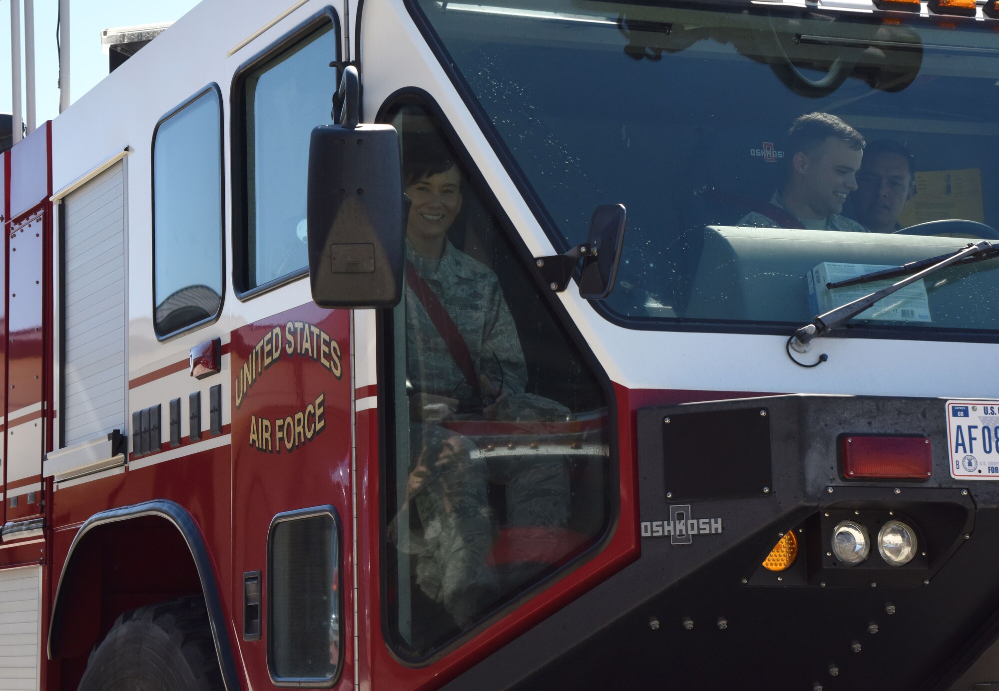 U.S. Air Force Col. Debra Lovette, 81st Training Wing commander, receives a courtesy ride in a fire truck during an  open house at the fire station at Keesler Air Force Base, Mississippi, Oct. 13, 2018. Keesler ended its Fire Prevention Week celebration with  an open house which consisted of displays, fire tuck rides and fire prevention demonstrations. (U.S. Air Force photo by Kemberly Groue)