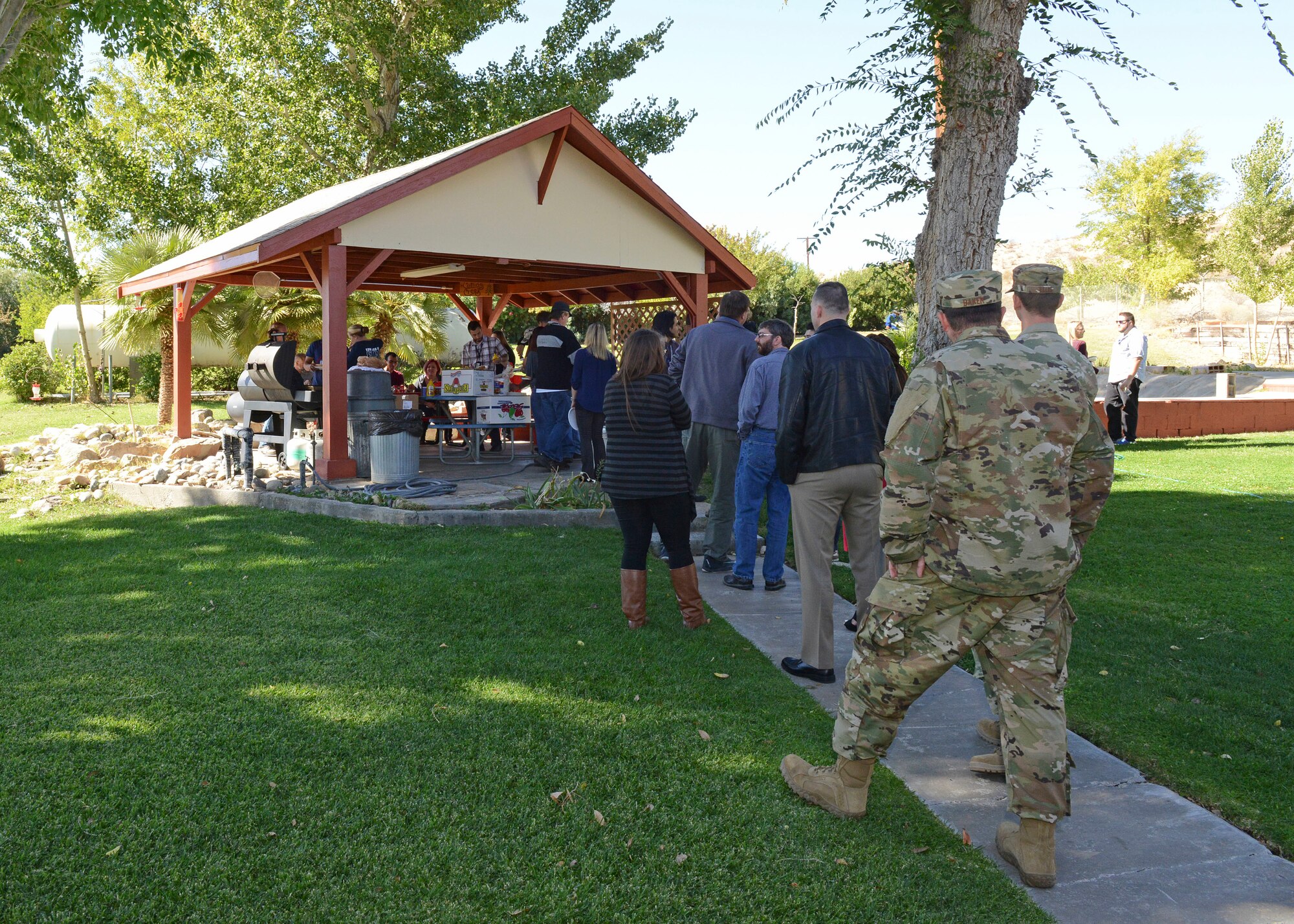 Team Edwards members from Air Force Research Laboratory Detachment 7 line up to get a complimentary hot dog and hamburger during an open house at Fire Station #4 Oct. 11. (U.S. Air Force photo by Kenji Thuloweit)