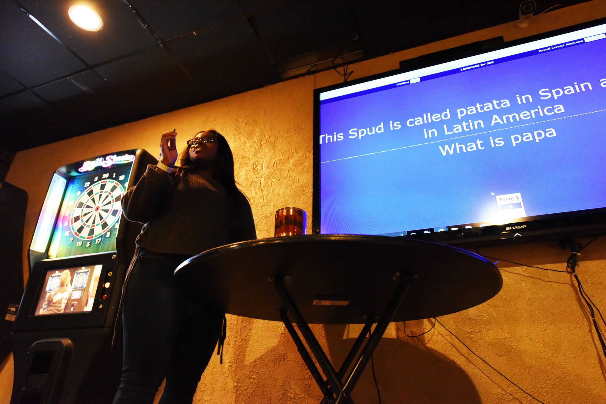 Senior Airman Kashe Smith, a 28th Medical Group public health technician, asks a question about Hispanic culture at Ellsworth Air Force Base, S.D., Oct. 12, 2018. The trivia night was held in celebration of Hispanic Heritage Month, which is celebrated nationwide Sept. 15-Oct. 15. (U.S. Air Force photo by Airman 1st Class Thomas Karol)