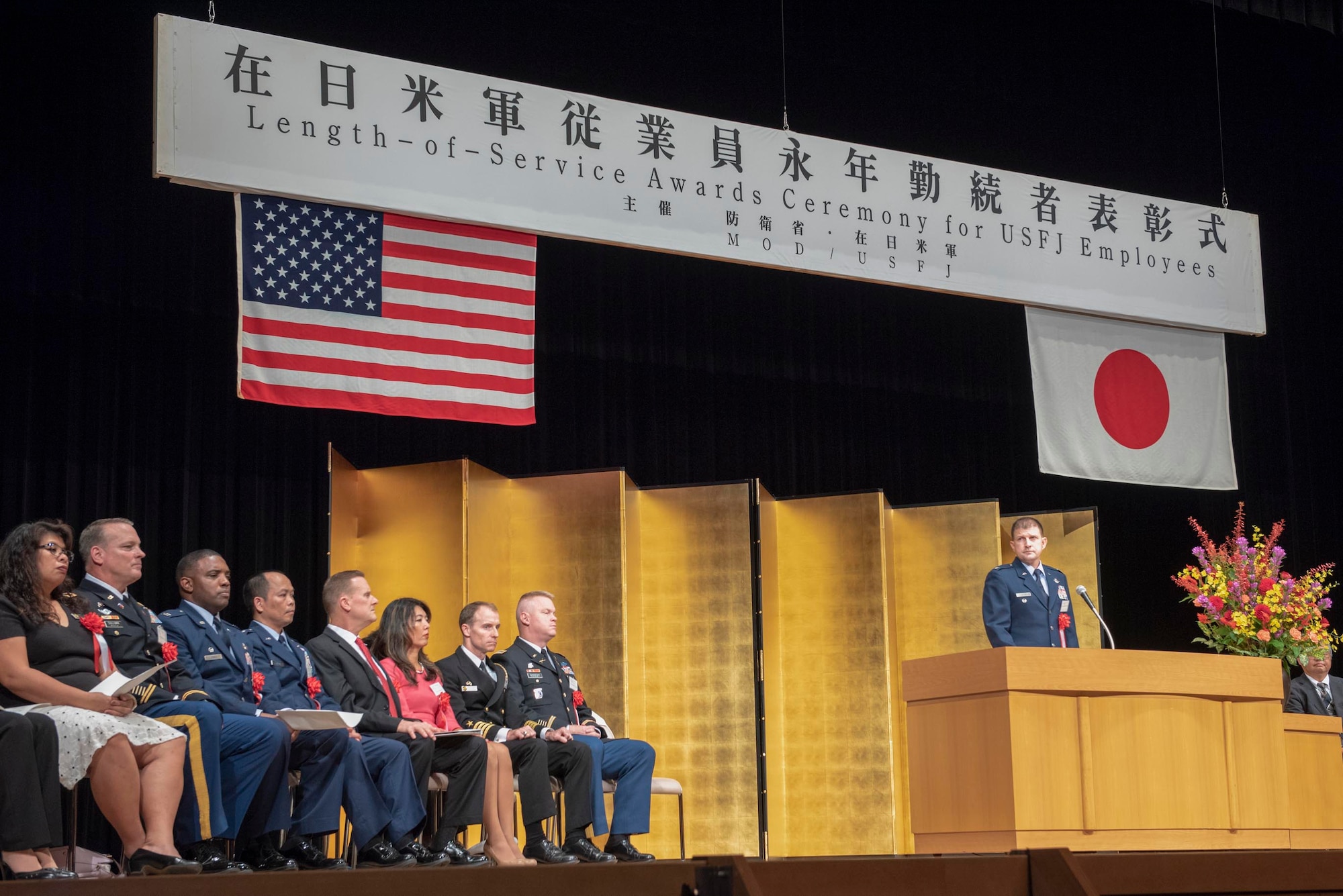 Col. Dominic A. Setka, 5th Air Force chief of staff, pauses for his speech to be translated at the USFJ Length-of-Service Awards Ceremony at the Yutorogi Hall in Hamura City, Japan, Oct. 10, 2018.