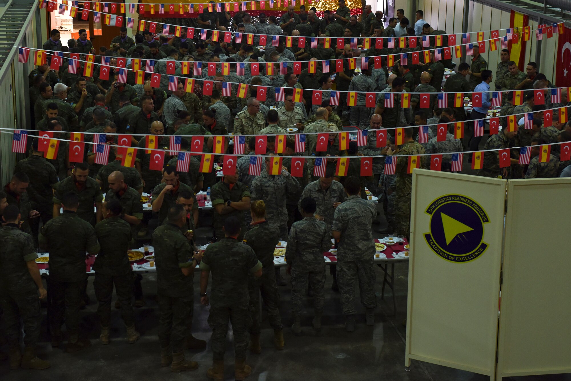 U.S. Air Force, Spanish Army and Turkish Air Force service members gather to enjoy Spanish food, following the Hispanity Day parade at Incirlik Air Base, Turkey, Oct. 12, 2018.