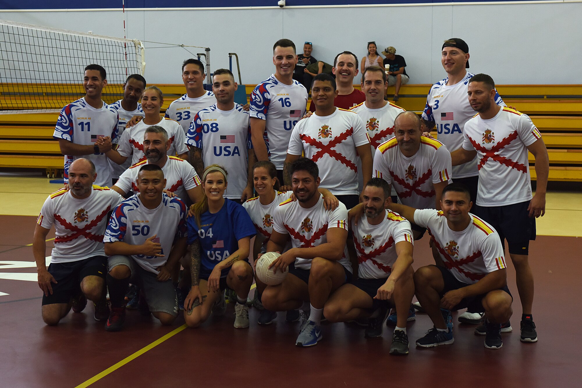 U.S. Air Force and Spanish Army members pose for a photo at the Hispanity Day Volleyball Tournament at Incirlik Air Base, Turkey, Oct. 13, 2018.