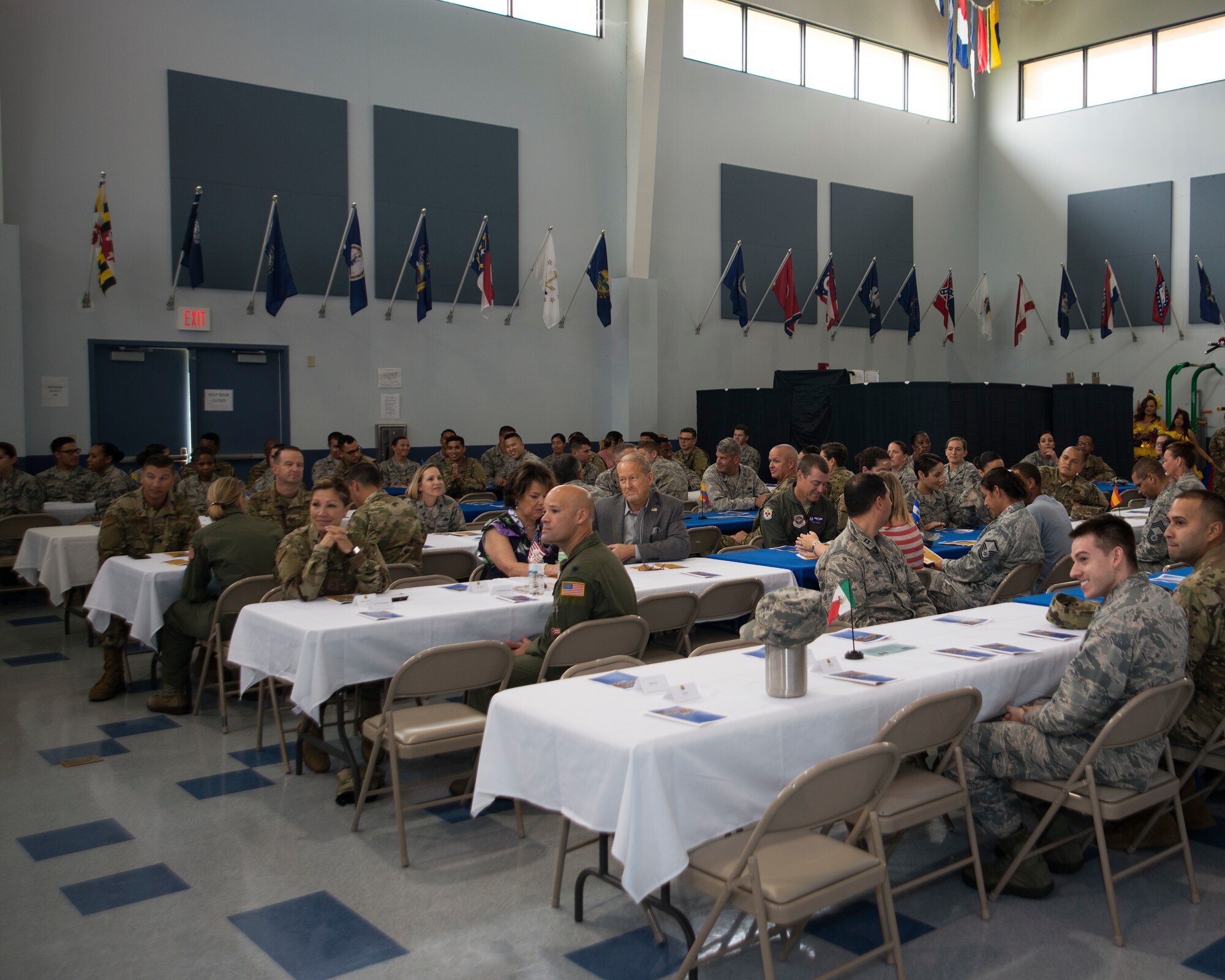 Attendees listen to the National Hispanic Heritage month luncheon opening remarks by U.S. Air Force Col. Stephen Snelson, 6th Air Mobility Wing Commander, at MacDill Air Force Base, Fla., Oct. 11, 2018.