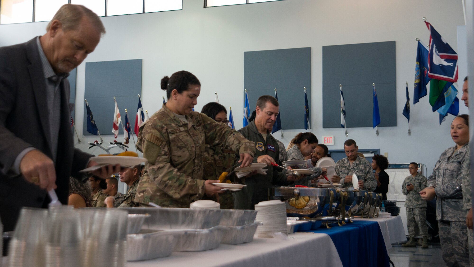 Attendees move through the National Hispanic Heritage month luncheon food line at MacDill Air Force Base, Fla., Oct. 11, 2018.