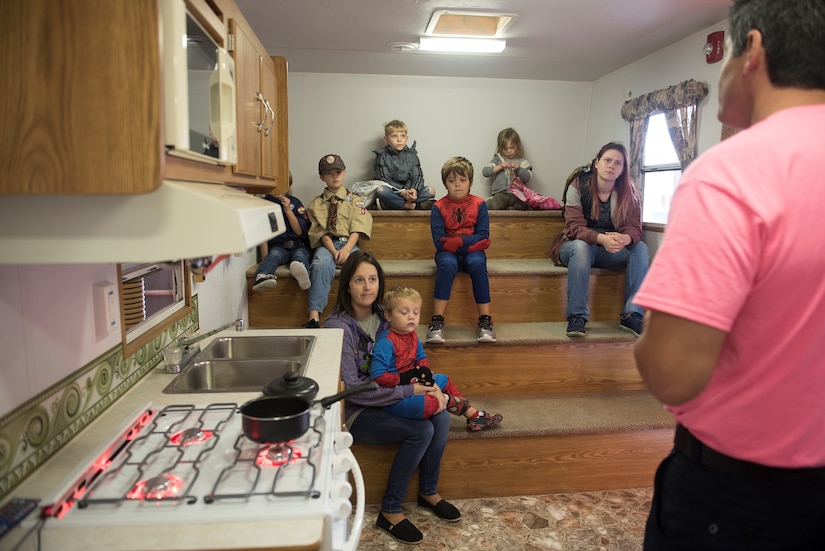 Robert Beltz, Fort Eustis Fire and Emergency Services fire inspector, teaches kitchen fire safety to children during the Fort Eustis FES Open House event at Joint Base Langley-Eustis, Va., Oct. 13, 2018.