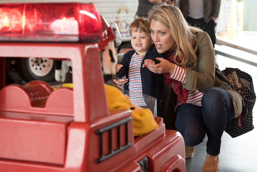 Tristan Zampelli, age 2, son of U.S. Army Col. Rick Zampelli, 128th Aviation Brigade commander, and his mother Jayne Zampelli, talk to Sparky the Robot Dog during the Fort Eustis Fire and Emergency Services Open House event at Joint Base Langley-Eustis, Va., Oct. 13, 2018.