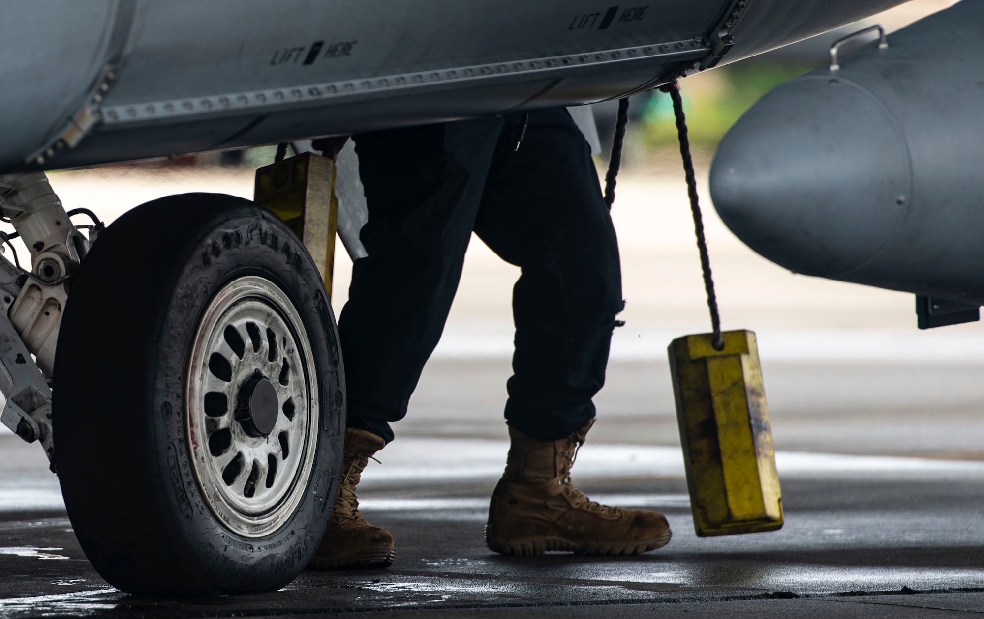 A U.S. Air Force tactical aircraft maintainer removes chalks from an F-16CM Fighting Falcon at Shaw Air Force Base, S.C., Oct. 10, 2018.