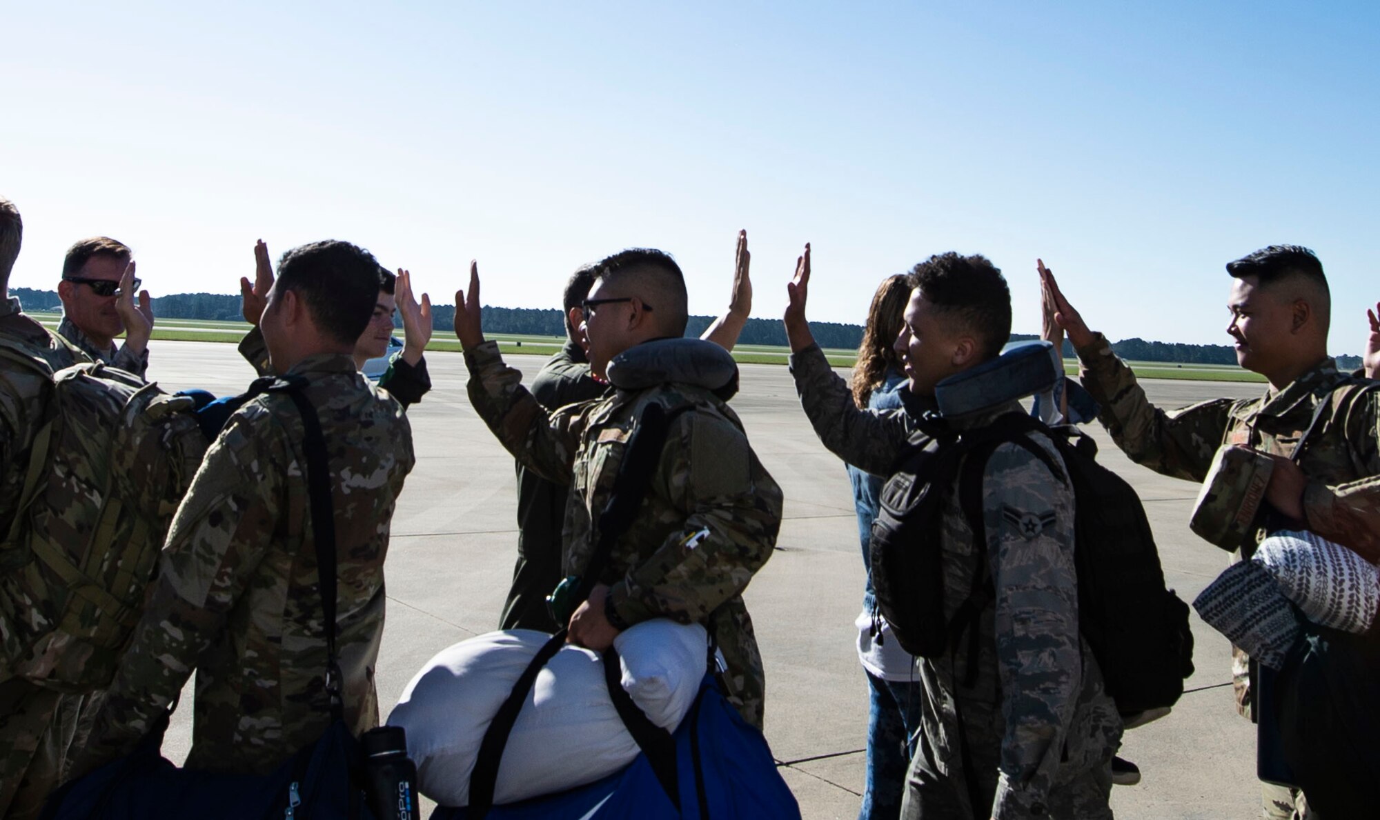 U.S. Airmen assigned to the 20th Fighter Wing interact with base leadership prior to deploying from Shaw Air Force Base, S.C., Oct. 13, 2018.