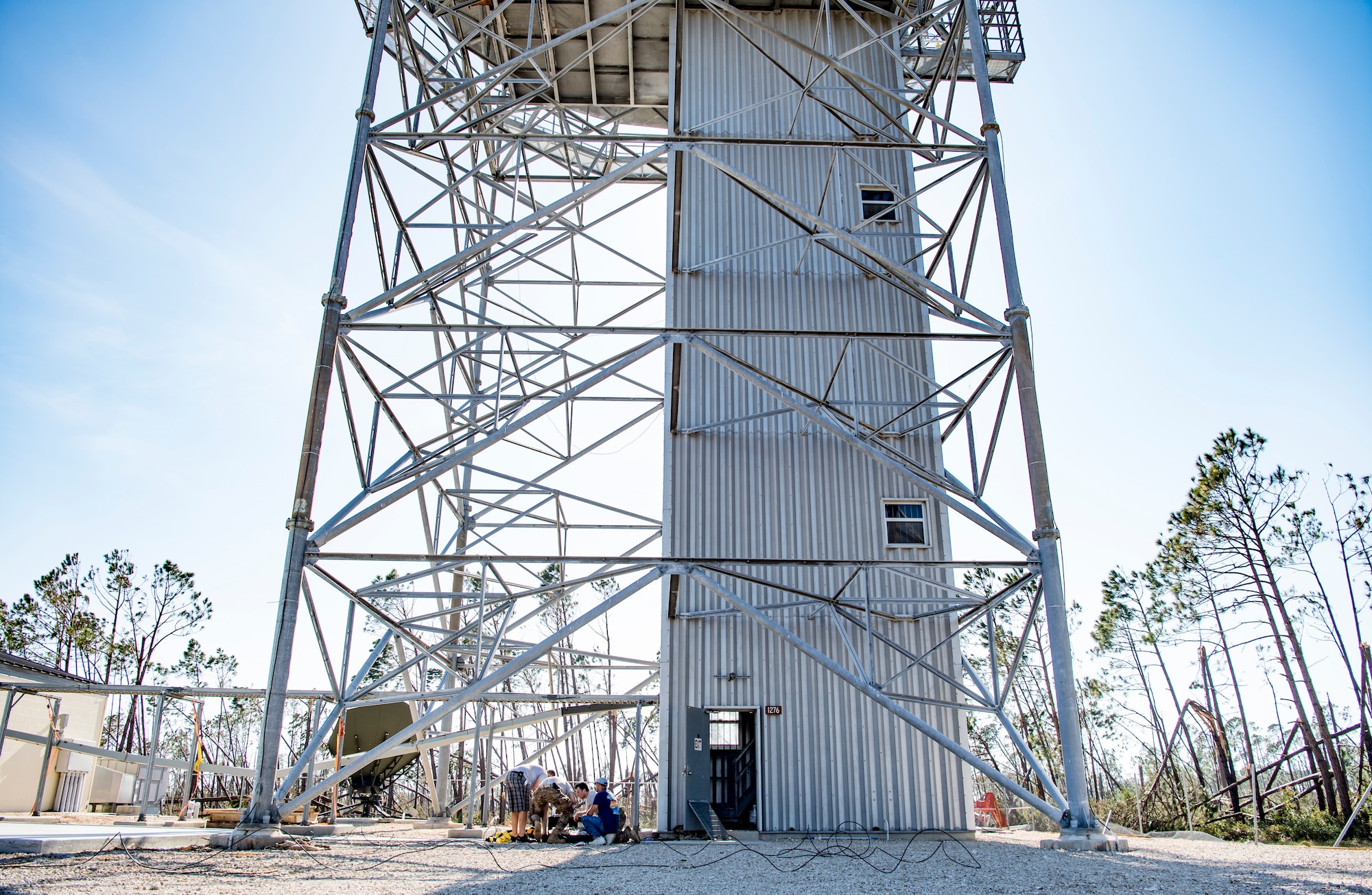 Members of the 5th Combat Communications Group, Robins Air Force Base, Georgia, restore RADAR capabilites following the aftermath of Hurricane Michael at Tyndall Air Force Base, Florida, Oct. 15, 2018. Multiple major commands have mobilized relief assets in an effort to restore operations after the hurricane caused catastrophic damage to the base. (U.S. Air Force photo by Senior Airman Keifer Bowes)
