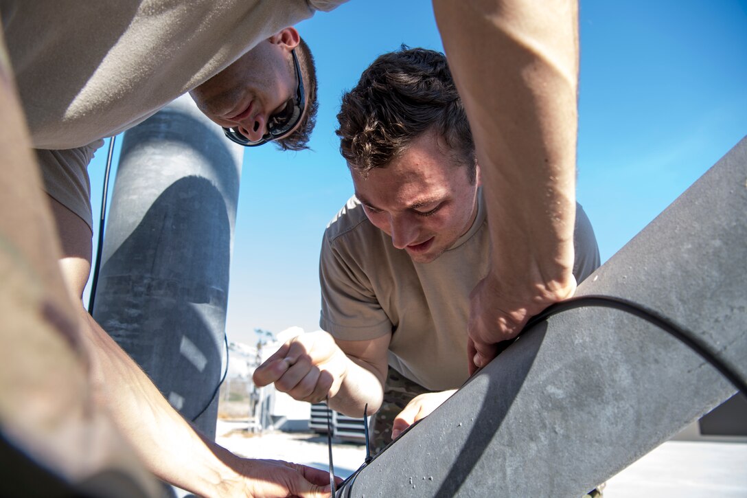 Members of the 5th Combat Communications Group, Robins Air Force Base, Georgia, restore RADAR capabilites following the aftermath of Hurricane Michael at Tyndall Air Force Base, Florida, Oct. 15, 2018. Multiple major commands have mobilized relief assets in an effort to restore operations after the hurricane caused catastrophic damage to the base. (U.S. Air Force photo by Senior Airman Keifer Bowes)