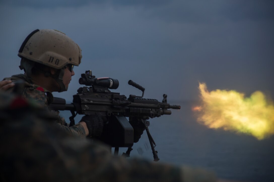 A reconnaissance Marine with the 31st Marine Expeditionary Unit’s Amphibious Reconnaissance Platoon fires an M249 squad automatic weapon during marksmanship training aboard the amphibious assault ship USS Wasp, underway in the East China Sea, Oct. 16, 2018. Marines with ARP specialize in close-quarters tactics during amphibious operations. The 31st MEU, the Marine Corps’ only continuously forward-deployed MEU, provides a flexible force ready to perform a wide-range of military operations in the Indo-Pacific region.