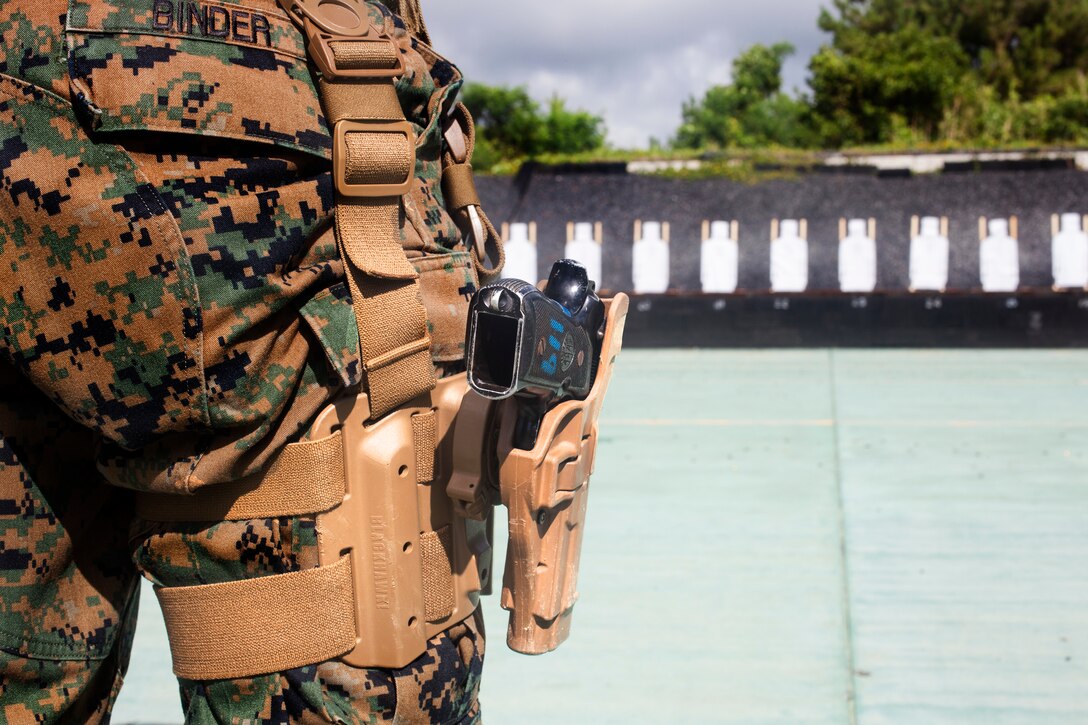 U.S. Marine Cpl. Bradley Binder conducts pistol qualification with a Beretta M9 service pistol at Camp Hansen, Okinawa, Japan, Sept. 6, 2018. Binder, a native of Milwaukee, Wisconsin, is a squad leader with 3rd Law Enforcement Battalion, III Marine Expeditionary Force Information Group. Pistol qualification is required annually to sustain the skills of pistol marksmanship.