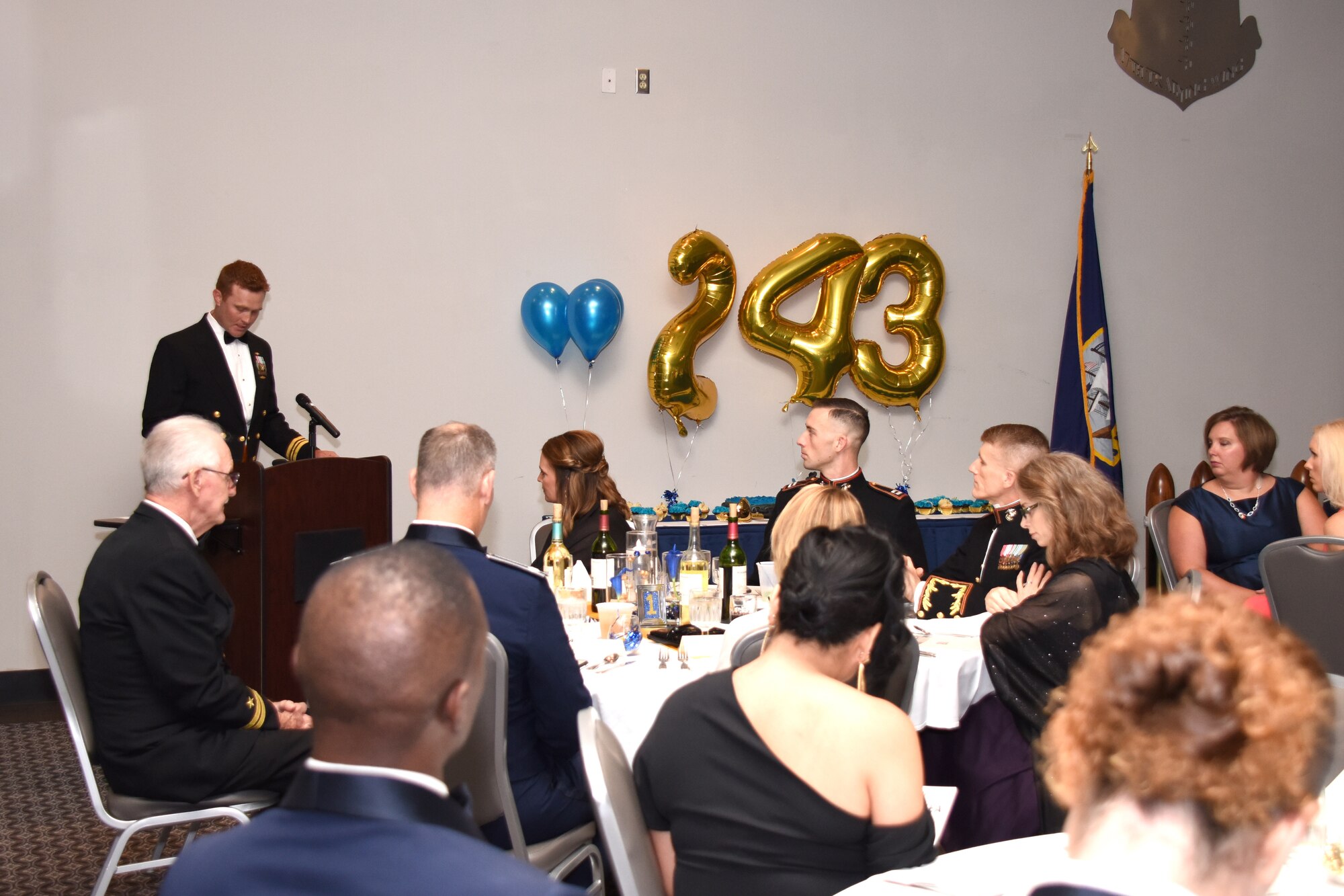 U.S. Navy Lt. Cmdr. J. Austin Maxwell, Navy Center for Information Warfare Training Detachment Goodfellow officer in charge, remarks on the heritage of the Navy and what the theme means to him at the 243rd Navy Day Ball at the Event Center on Goodfellow Air Force Base, Texas, Oct. 12, 2018. Forged by the Sea, the theme of this year’s ball, focused on the changes the Navy has undergone and the toughness, initiative, integrity and accountability of its Sailors. (U.S. Air Force photo by Airman 1st Class Seraiah Hines/Released)