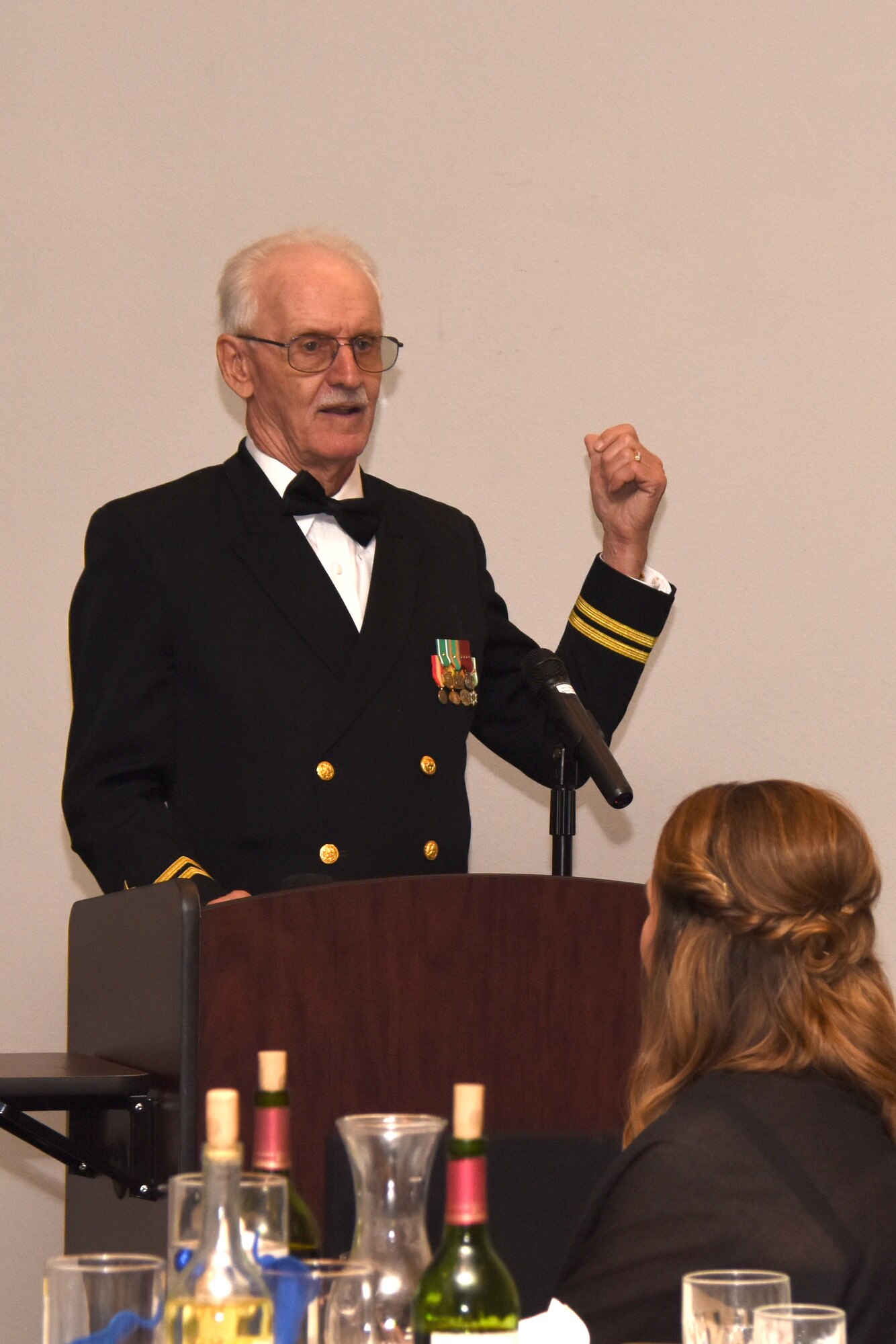 Retired U.S. Navy Lt. Delavan Pfranger, guest speaker, recounted his career in the Navy and how it changed his life during the 243rd Navy Day Ball at the Event Center on Goodfellow Air Force Base, Texas Oct. 12, 2018. The Navy Center for Information Warfare Training was established on Goodfellow in 1966 under the command and support of the Chief of Naval Personnel. (U.S. Air Force photo by Airman 1st Class Seraiah Hines/Released)