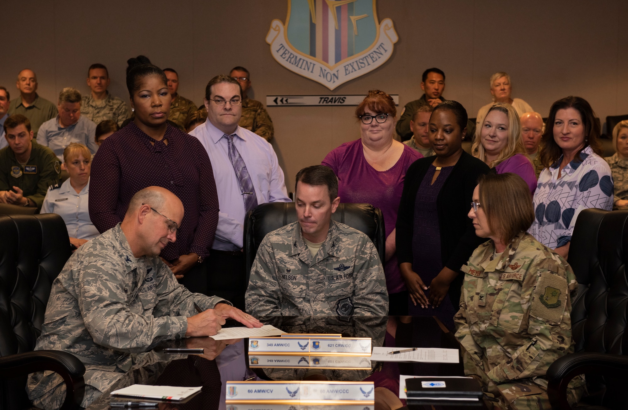 Team Travis leadership sign proclamation designating October as Domestic Violence Awareness Month