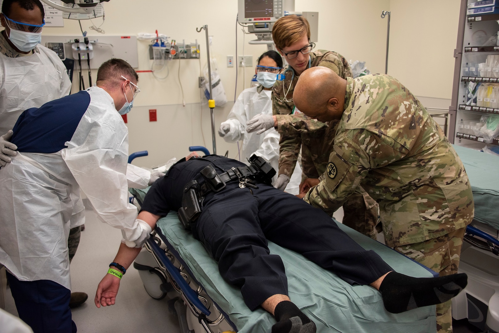 Members of Brooke Army Medical Center’s medical staff assist an exercise role player during the 2018 San Antonio Mass Casualty Exercise and Evaluation at Brooke Army Medical Center Oct. 11. Nearly 700 volunteers role-played as victims and family members during the largest mass casualty exercise ever held in San Antonio.