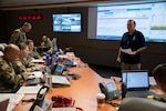 Steven Burton (right), emergency manager, briefs members of the Emergency Operations Center during the 2018 San Antonio Mass Casualty Exercise and Evaluation at Brooke Army Medical Center Oct. 11. The exercise simulated an active shooter scenario to test the capabilities of hospitals and emergency responders in the San Antonio area.