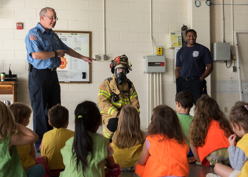 Members of the 633rd Civil Engineer Squadron teach fire prevention tips to children from the NASA Langley Child Development Center pre-k class at Joint Base Langley-Eustis, Virginia, Oct. 10, 2018.