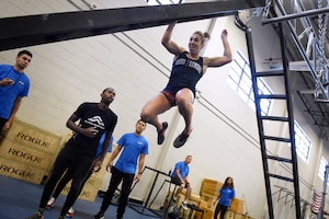 Capt. Abigail Wilkins, an Air Force ROTC instructor at Valdosta State University, Ga., leaps across an incline ladder during the Alpha Warrior regional championship Oct. 13, 2018, at Joint Base Charleston, S.C.