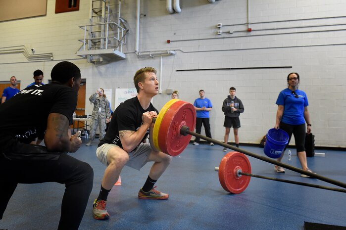 Senior Airman Jacob Wuerth, a crew chief assigned to the 437th Maintenance Squadron, performs weighted squats during the Alpha Warrior regional championship Oct. 13, 2018, at Joint Base Charleston, S.C.