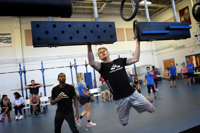 Senior Airman Jacob Wuerth, a crew chief assigned to the 437th Maintenance Squadron, navigates a horizontal wall during the Alpha Warrior regional championship Oct. 13, 2018, at Joint Base Charleston, S.C.