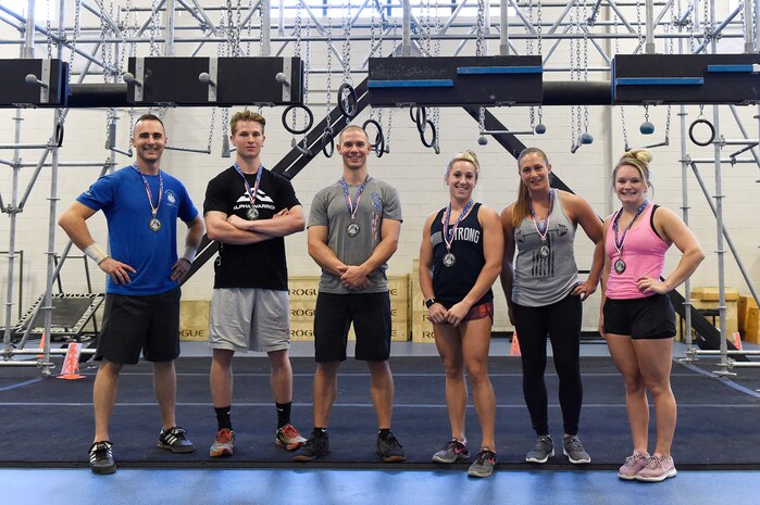 The top three male and female competitors display their medals after completing the Alpha Warrior regional competition Oct. 13, 2018, at Joint Base Charleston, S.C.