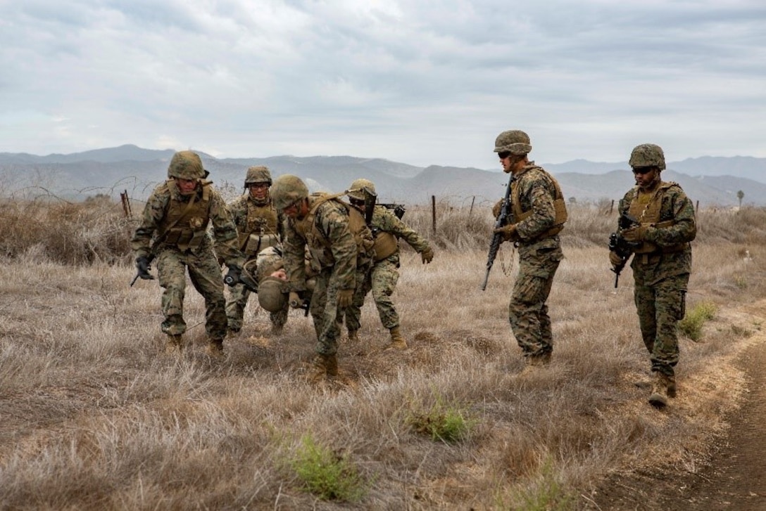 U.S. Marines with Service Company, 9th Communications Battalion, I Marine Expeditionary Force Information Group, conduct a casualty evacuation drill at Marine Corps Base Camp Pendleton, Oct. 2, 2018. The drill was part of a field exercise the battalion executed providing the Marines realistic combat training. (U.S. Marine Corps photo by Cpl. Cutler Brice.)