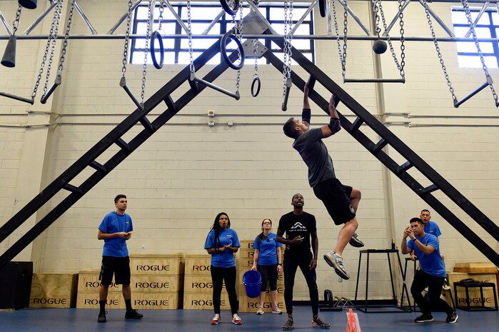 Maj. Andrew Kearl, assistant director of operations for the 16th Airborne Command and Control Squadron, climbs an incline ladder during the Alpha Warrior regional competition Oct. 13, 2018, at Joint Base Charleston, S.C.