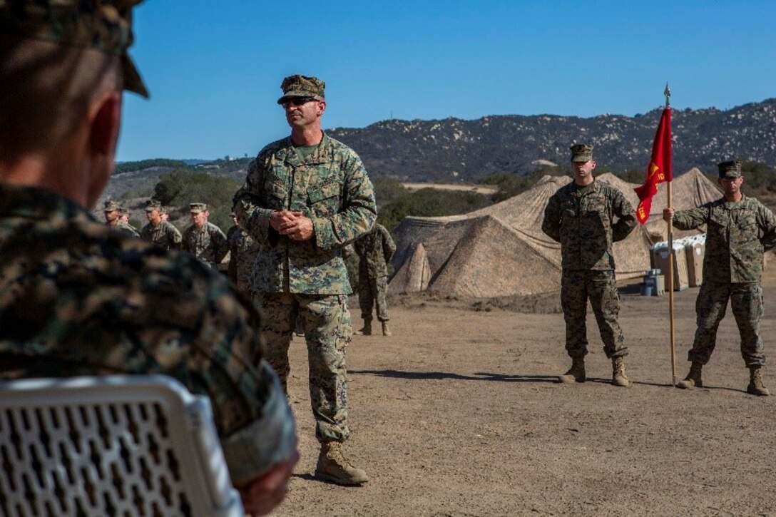 U.S. Marine Lt. Col. Bryan Eovito, commanding officer of 9th Communications Battalion, I Marine Expeditionary Force Information Group, addresses leadership and guests during the activation ceremony for the Defensive Cyberspace Operations – Internal Defensive Measures Company at Marine Corps Base Camp Pendleton, California, Oct. 1, 2018. The 9th Comm DCO-IDM Company is the first of three such companies the Marine Corps will activate in accordance with Force Modernization 2025. Defensive Cyberspace Operations Company provides added security to the Marine Corps Enterprise Network by executing offensive cyberspace operations to defend the Marine Air-Ground Task Force information networks across all domains. (U.S. Marine Corps photo by Cpl. Cutler Brice)