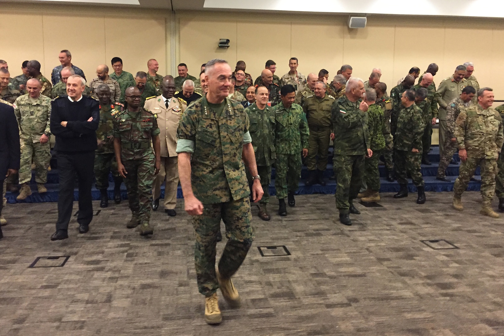 Marine Corps Gen. Joe Dunford, the chairman of the Joint Chiefs of Staff, leads his fellow chiefs of defense to a meeting on countering violent extremist organizations at Joint Base Andrews, Md.