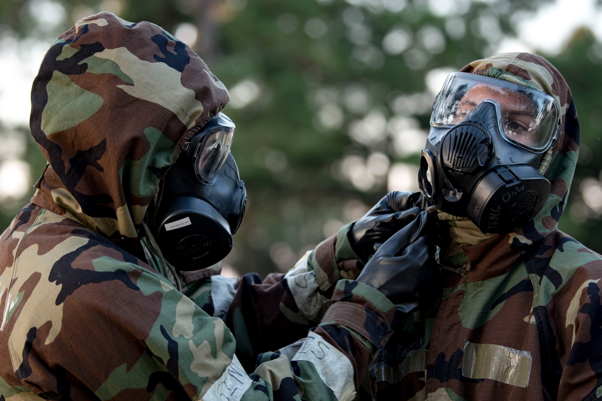Airmen from the 23d Civil Engineer Squadron perform buddy checks during the Ability to Survive and Operate (ATSO) Rodeo, Sept. 20, 2018, at Moody Air Force Base, Ga. Approximately 2,000 Airmen executed self-aid and buddy care, security and chemical attack avoidance missions under duress in a simulated chemical warfare environment. Testing and enhancing their operational readiness, this prepared the 23d Wing for the upcoming Phase II exercise during Nov. 5-8, 2018, which will be conducted for the first time in seven years. (U.S. Air Force photo by Airman Taryn Butler)