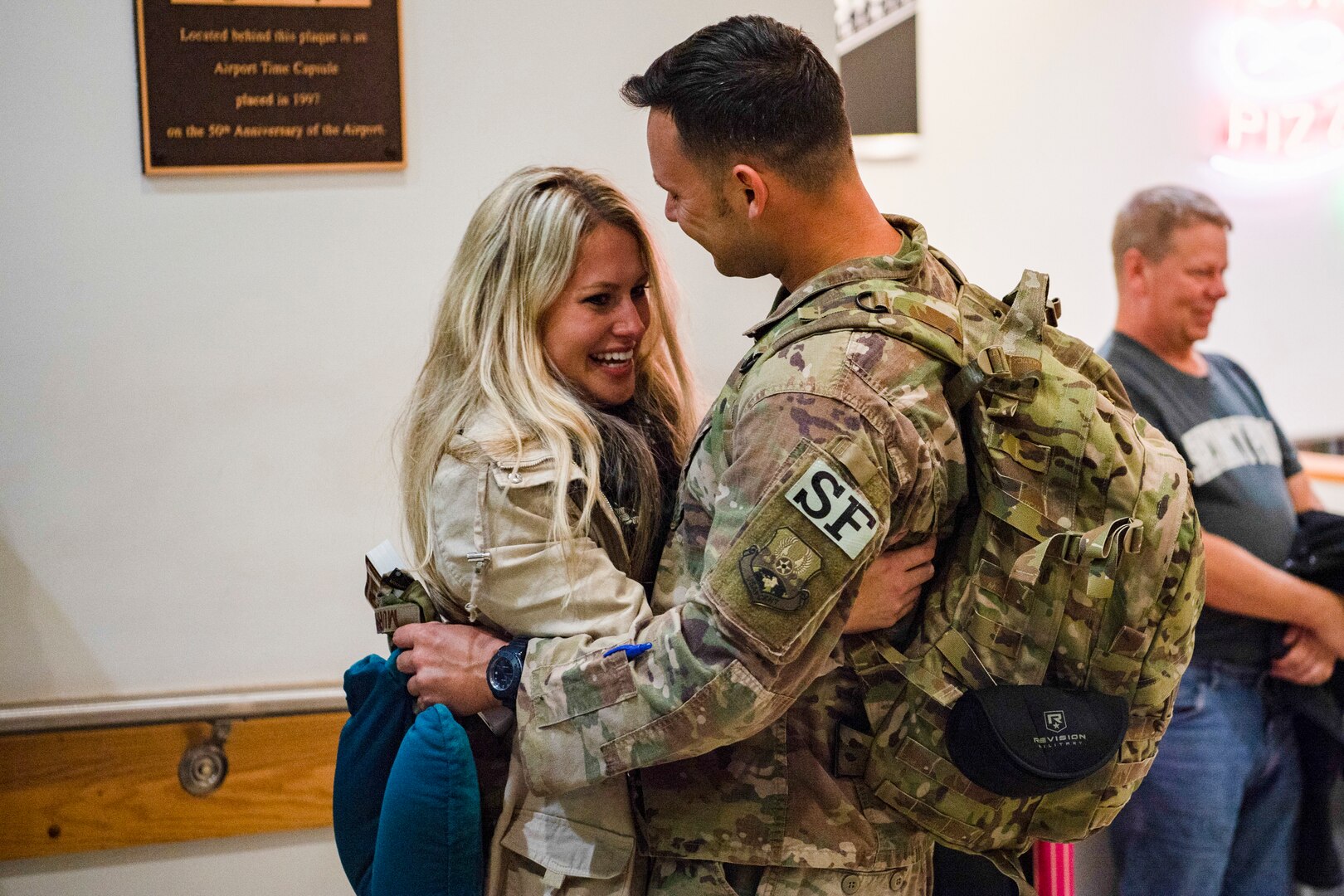 Members of the 130th Airlift Wing Security Forces Squadron embrace members of their family after arriving to Charleston, West Virginia Oct. 15, 2018, following a six month deployment to southwest Asia. (U.S. Air National Guard photo by Airman 1st Class Caleb Vance)