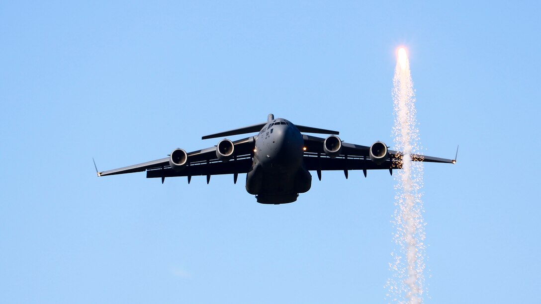 A C-17 Globemaster flies over Dodger Stadium during the opening ceremony of Game 3 of Major League Baseball’s National League Championship Series between the Los Angeles Dodgers and Milwaukee Brewers at Dodger Stadium in Los Angeles, California, Oct. 15. The C-17 began its flight from Edwards Air Force Base. (U.S. Air Force photo by Giancarlo Casem)