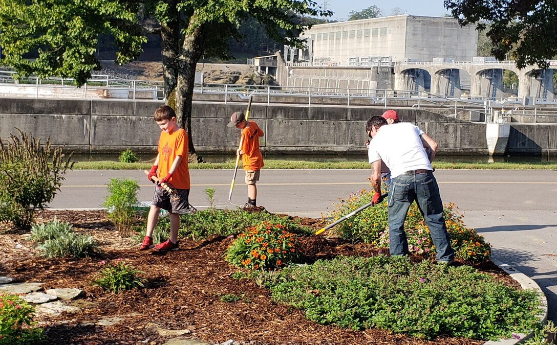 Boy Scouts with Pack 503 mulch a flower bed at Cheatham Lake Oct. 10, 2018 in Ashland City, Tenn. They joined U.S. Army Corps of Engineers Nashville District Park Rangers for the National Public Lands Day event near Cheatham Dam. (USACE photo by Dina Henninger)