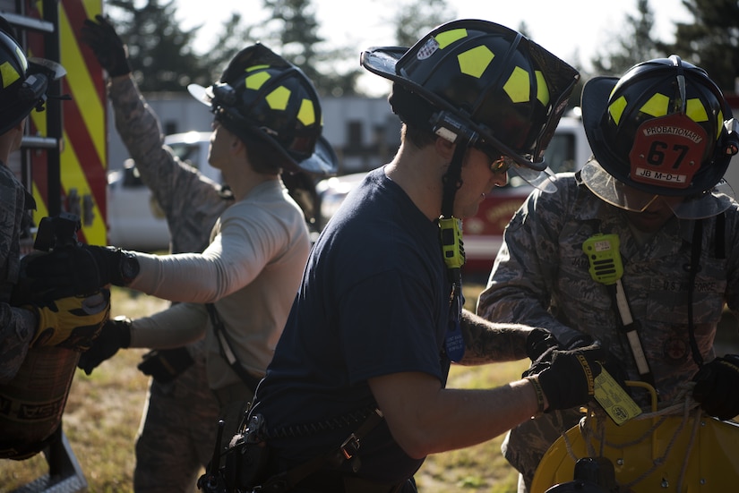 Airmen with the 87th Civil Engineer Squadron prepare equipment for a confined space rescue and safety inspection on Joint Base McGuire-Dix-Lakehurst, New Jersey, Oct. 3, 2018. The Airmen set up a triage station for victims that rescued from the confined space. The exercise consisted of extracting two training dummies from a confined space with dangerous gasses present. (U.S. Air Force photo by Airman First Class Ariel Owings)