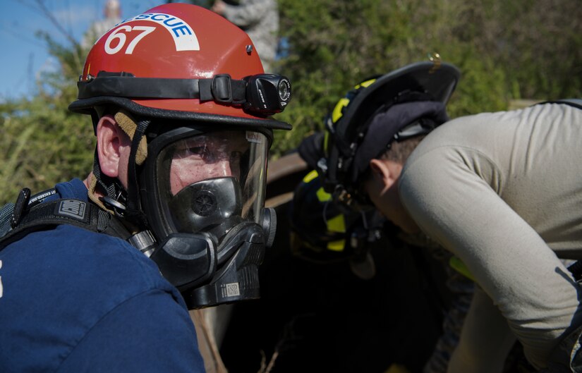 Patrick Dedella, 87th Civil Engineer Squadron Fire Captain, prepares to enter a tunnel during a confined space and safety inspection exercise on Joint Base McGuire-Dix-Lakehurst, New Jersey, Oct. 3, 2018. Dedella oversees and directs all fire ground operations during the removal of the victims. (U.S. Air Force photo by Airman First Class Ariel Owings)