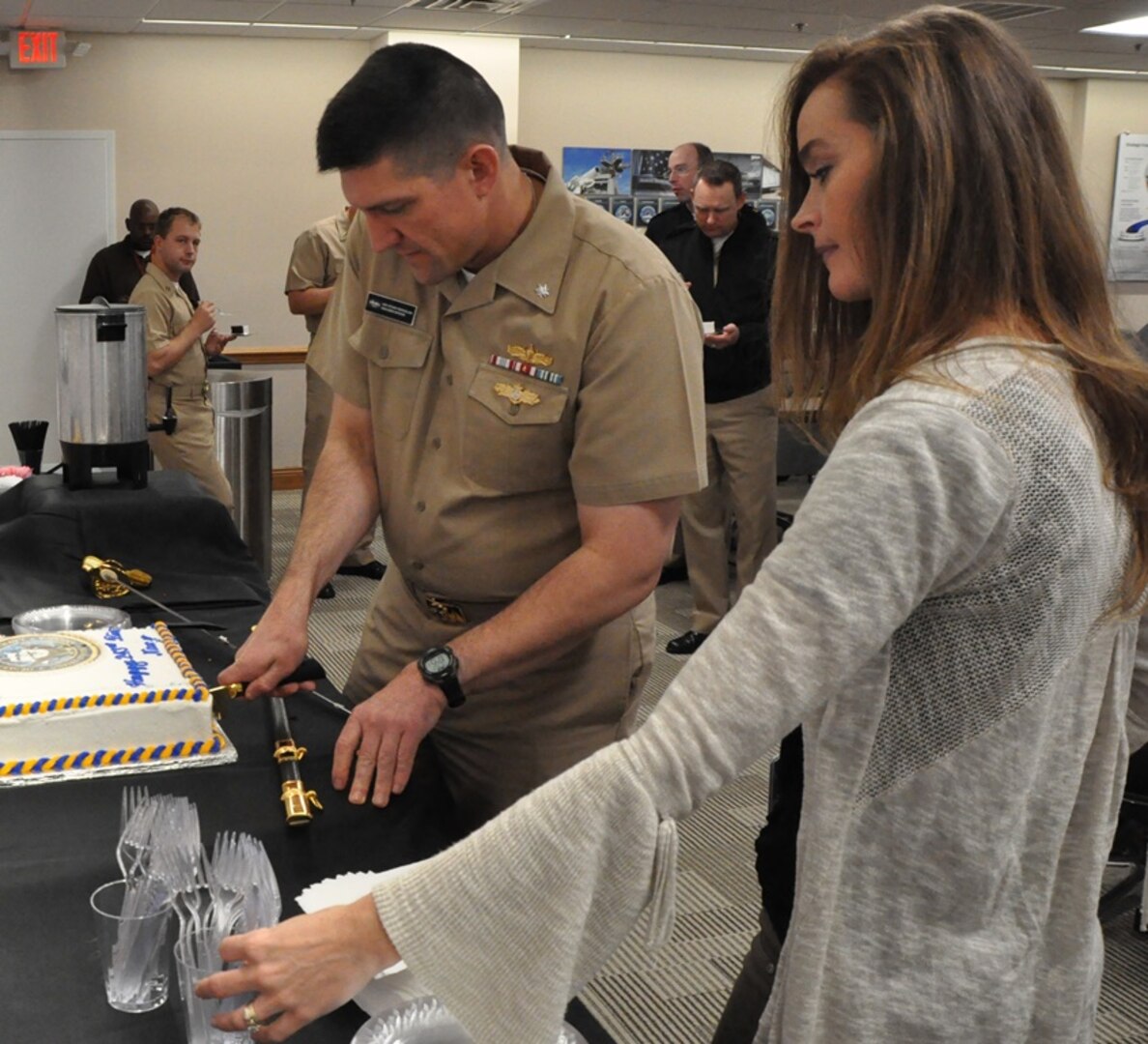 IMAGE: DAHLGREN, Va. (Oct. 12, 2018) - Cmdr. Steven Perchalski cuts the cake for those celebrating the Navy's 243rd birthday at the Naval Surface Warfare Center Dahlgren Division (NSWCDD). NSWCDD will celebrate 100 years of cutting-edge technological innovation in support of the warfighter at a centennial grand finale event Oct. 19 that includes an exhibition tent, a U.S. Navy Band performance, and historic tours featuring six station stops on base.