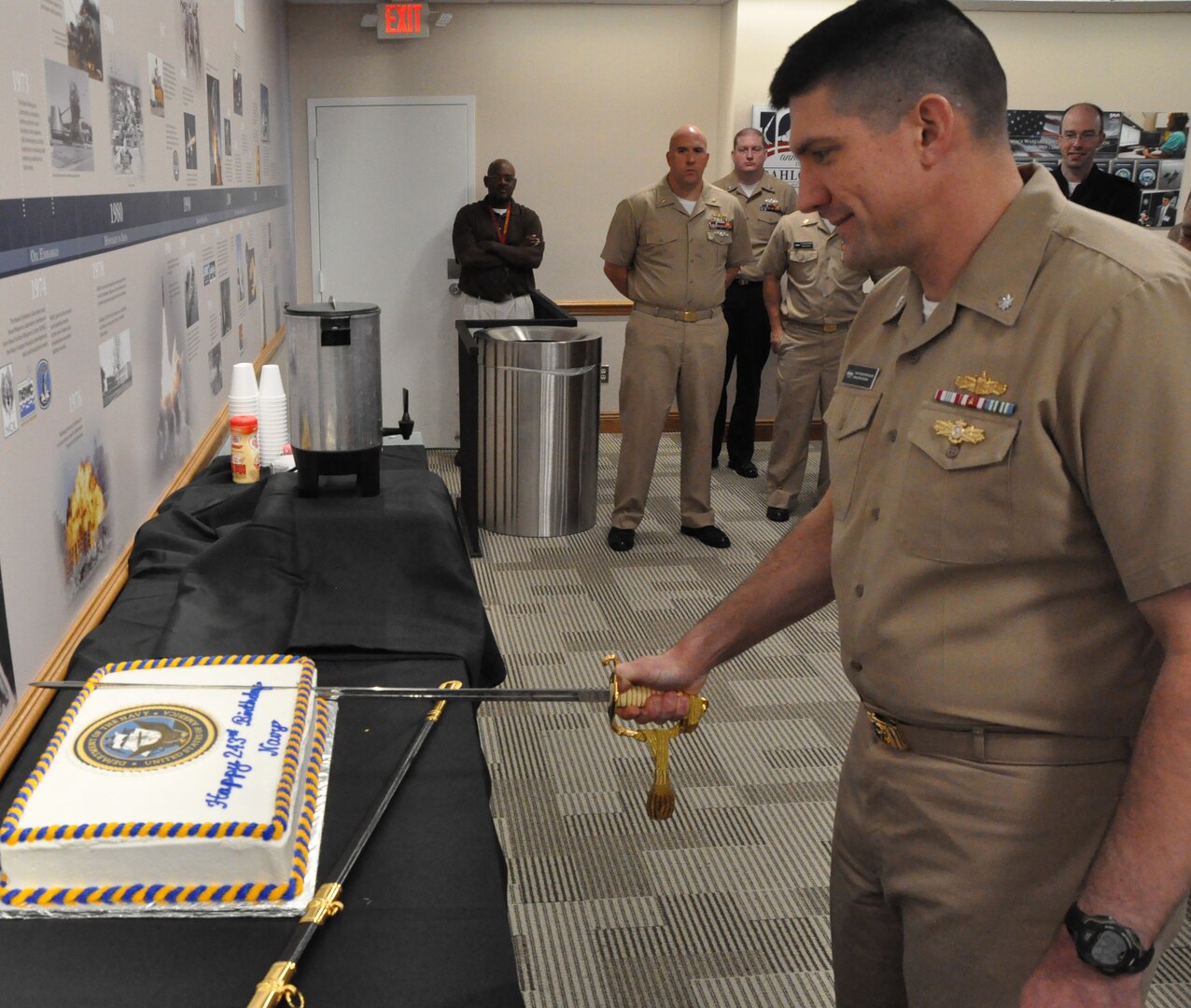 IMAGE: DAHLGREN, Va. (Oct. 12, 2018) - Cmdr. Steven Perchalski cuts the cake in celebration of the Navy's 243rd birthday at Naval Surface Warfare Center Dahlgren Division (NSWCDD). The event featured Perchalski as the command's oldest 
Sailor cutting the Navy's birthday cake with the command's youngest Sailor, Lt. Adam Mattison. The Navy birthday cake-cutting ceremony is important to all Sailors, as it is an annual renewal of each Sailor's commitment to the Navy and 
the Navy's commitment to our nation's quest for peace and freedom worldwide. Perchalski and Mattison cut the cake with a sword, a traditional reminder that NSWCDD Sailors are among a band of warriors, committed to carrying arms 
so that the United States and its people may live in peace.