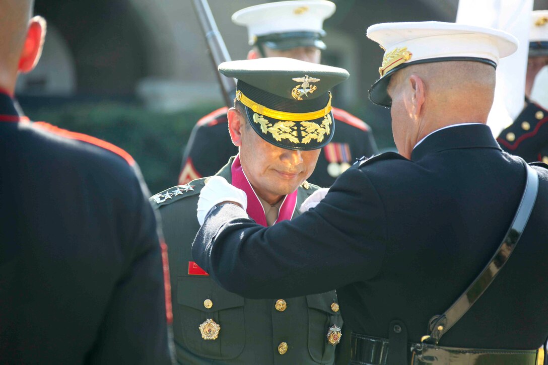Gen. Robert B. Neller, commandant of the U.S. Marine Corps, awards the Legion of Merit to Lt. Gen. Jun, Jin Goo, commandant of the Republic of Korea Marine Corps, during Jun’s visit to Washington, Sept. 5.  The U.S. and R.O.K. Marine Corps are the two largest Marine services in the world and work together to support their nations’ “ironclad” alliance.