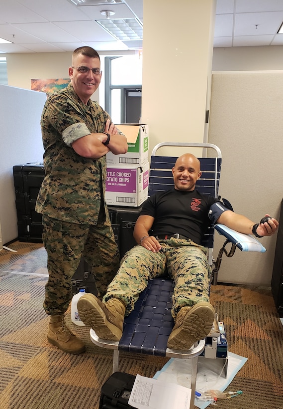 Col. John Atkinson, commanding officer of Headquarters and Service Battalion, thanks Gunnery Sgt. Carlos Perez for donating at the Armed Services Blood Program blood drive held on Sept. 11, 2018.