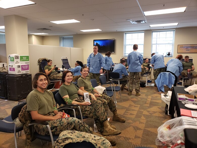 Marine Corp Base Quantico donors enjoying their snacks after rolling up their sleeves to donate at an Armed Services Blood Program blood drive held on Sept. 11, 2018.