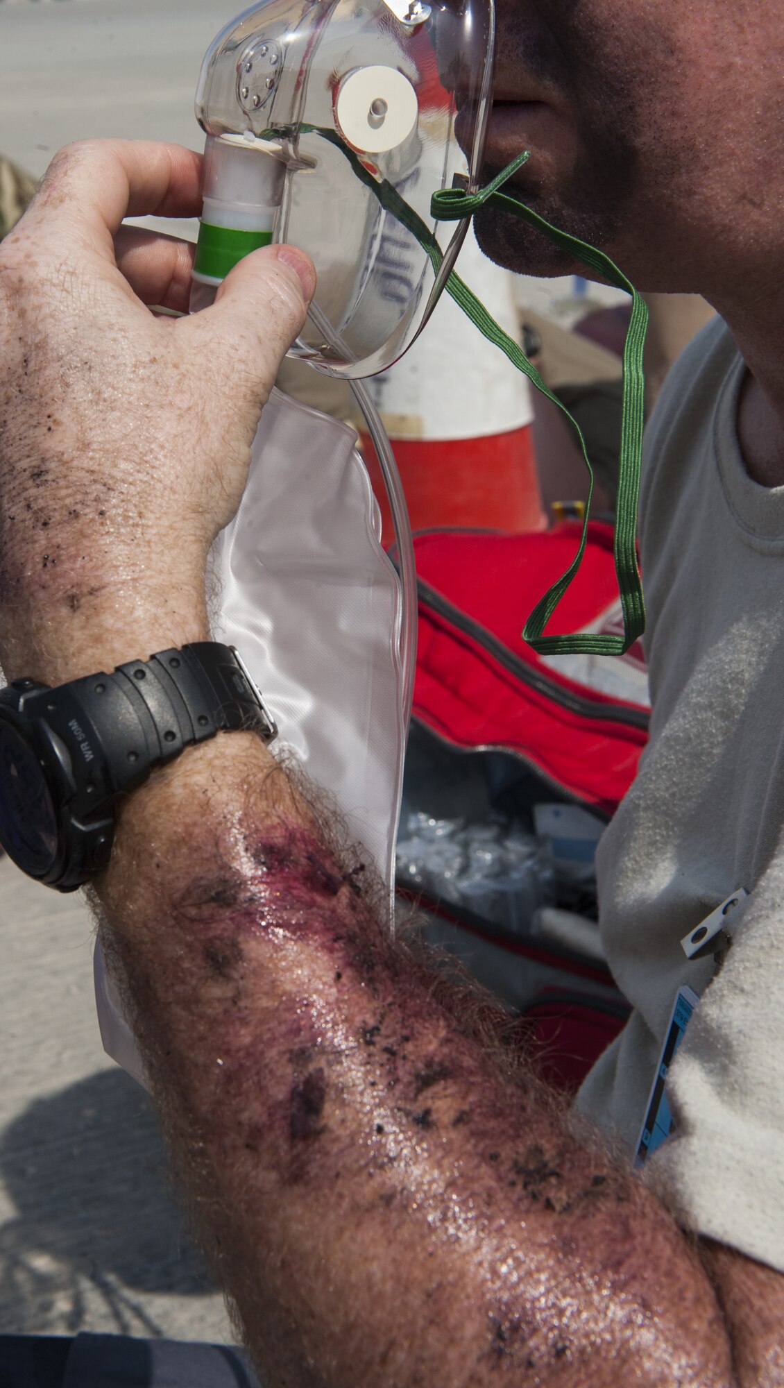 U.S. Air Force Maj. Alan Harmon, a 379th Expeditionary Medical Support Squadron nurse, breathes from an oxygen mask after his rescue from a “crashed” aircraft during Atlas Mountain, a Royal Air Force led exercise held at Al Udeid Air Base, Qatar, Oct. 16, 2018.