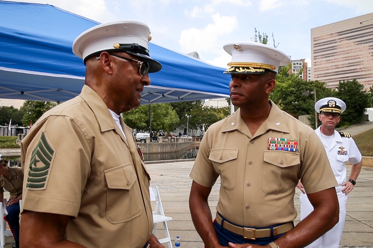 Current Marine talks with veteran Marine.