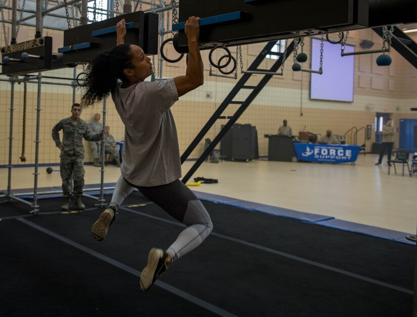 U.S. Air Force 1st Lt. Nicole Mitchell, 83rd Network Operations Squadron crew commander, moves across the cliffhanger board during the Alpha Warrior Northeast Regional Competition at Joint Base Langley-Eustis, Virginia, Oct. 13, 2018.