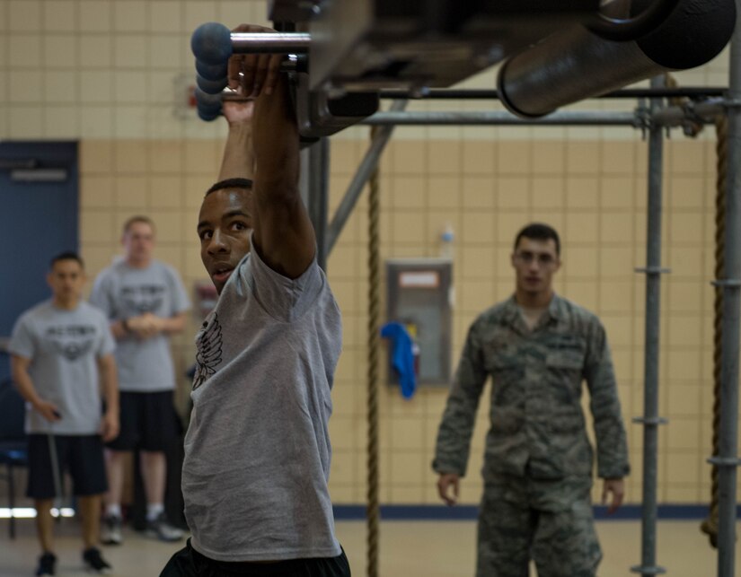 U.S. Air Force Staff Sgt. Earl White, 1st Maintenance Squadron aircraft fuel systems maintenance craftsman, moves across the ring board during the Alpha Warrior Northeast Regional Competition at Joint Base Langley-Eustis, Virginia, Oct. 13, 2018.