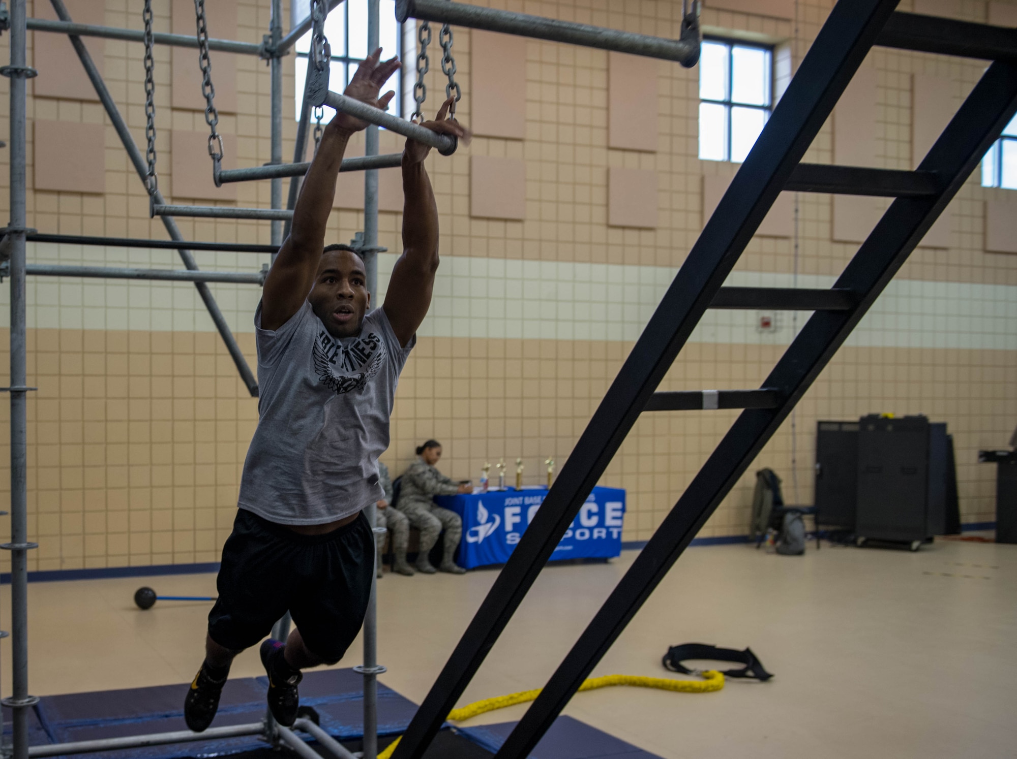 U.S. Air Force Staff Sgt. Earl White, 1st Maintenance Squadron aircraft fuel systems maintenance craftsman, jumps onto the broken bars during the Alpha Warrior Northeast Regional Competition at Joint Base Langley-Eustis, Virginia, Oct. 13, 2018.
