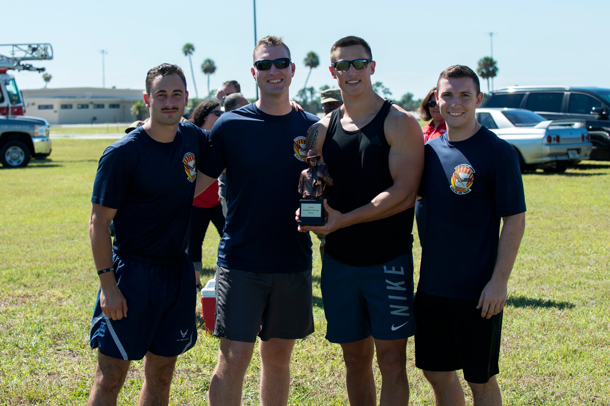 The 2018 Fire Muster winning team from the 6th Contracting Squadron pause for a photo at MacDill Air Force Base, Fla., Oct. 12, 2018.